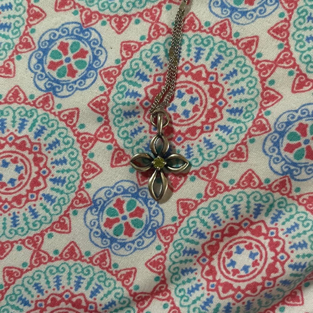 James Avery cross necklace with green peridot stone